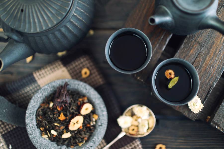 purple tea set on wooden table